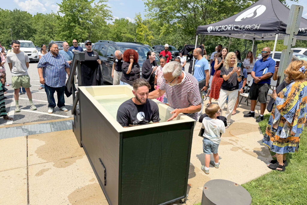 Young man being baptized at Victory Church in Audubon, PA